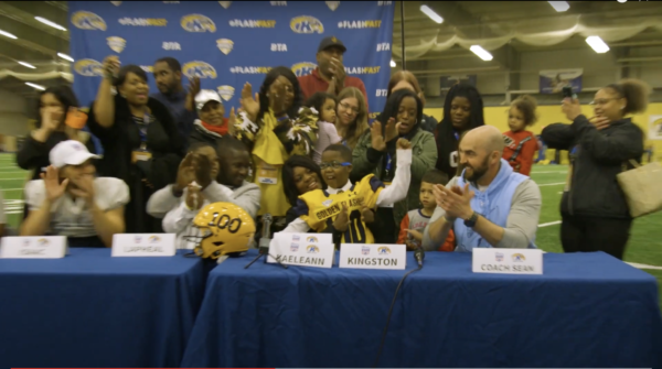 Kingston celebrates with members of the Kent State football team and Team Impact