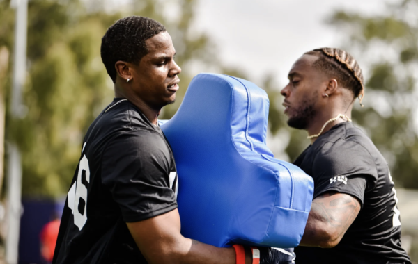 Quinlen hits the pads at training camp
